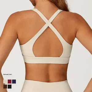 Cross-back yoga bra in cream white with teardrop cutout and five color options