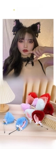 Detail of plush cat ears headband with cute bows and bells in multiple colors