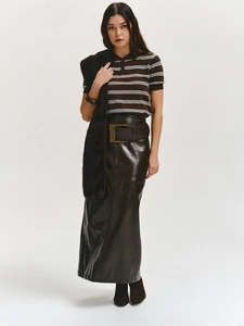 Slim fit striped polo shirt paired with leather skirt and wide belt in full model shot