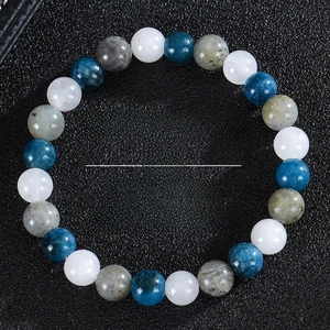 Detail of 7 Chakras natural stone beads on black leather with New Beginnings card