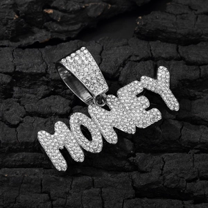 Detailed macro view of silver MONEY letter pendant with sparkling rhinestones inlay