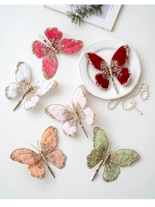 Detail of velvet butterfly clips with glitter edges and beads for Christmas tree decor