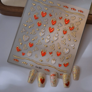 3D embossed nail art stickers with gold foil hearts and crown patterns on display tips