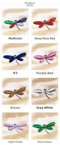 Detail showing eight color variants of rhinestone dragonfly brooches on champagne satin
