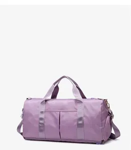 Detail view of purple yoga fitness bag showing the side zipper shoe compartment