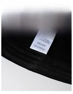 Close-up of the wide moisture-wicking sweatband and 100% cotton label on the black cap
