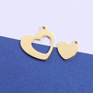 Polished gold stainless steel heart charms with a hollow and solid pendant set