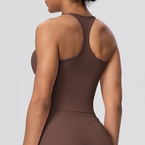 Detail of racerback design on dark coffee yoga vest showing breathable fabric texture