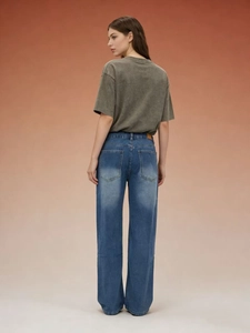 Rear view of high waist straight jeans with back pocket details and vintage washed texture