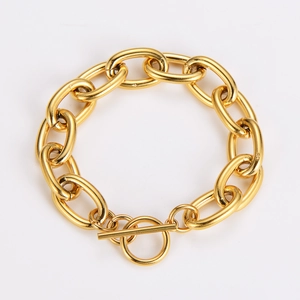 Detailed view of a gold 12mm thick oval link chain bracelet with a classic toggle clasp