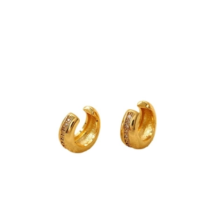 Minimalist gold C-shaped earrings with fine matte texture and sparkling zircon inlay