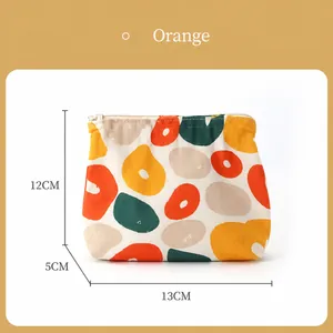 Mini waterproof cosmetic bag with vibrant orange fruit print measuring 13cm x 12cm