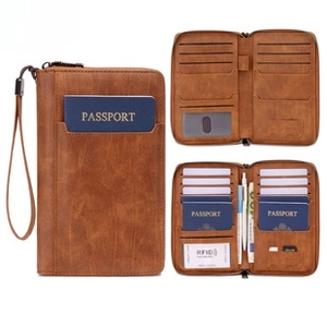 Detailed view of brown RFID blocking travel wallet with multiple slots for passport and cards