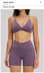 Front model view of mauve sports bra with thin straps and V-shaped yoga shorts