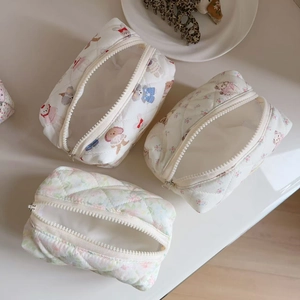 Set of three cute cartoon quilted cotton cosmetic bags with bear and floral patterns