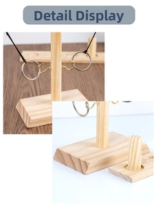 Detail of wooden ring toss game featuring pine texture hooks and scoreboard base