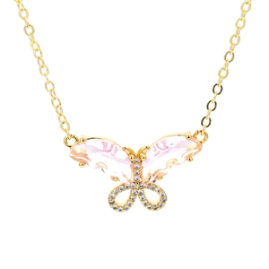 Detailed view of butterfly pendant with pink pear-cut crystals and pavé cubic zirconia