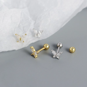 Detail of s925 silver butterfly earrings with sparkling cubic zirconia and screw back