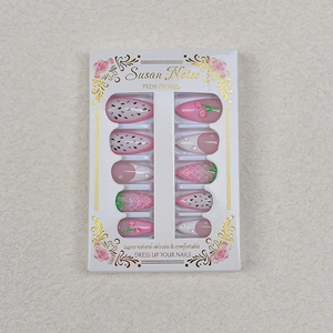 Macro detail of 3D strawberry embossment and cherry patterns on 24pcs press-on nails
