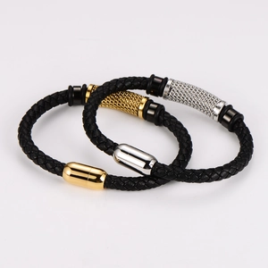 Detail of woven leather bracelets with magnetic clasps in gold and silver finish