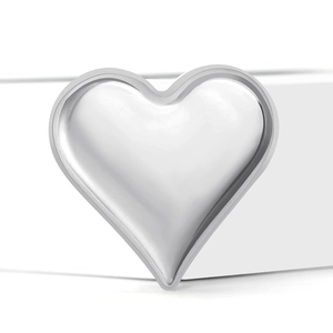 Minimalist silver heart brooch with polished metal finish on geometric white background