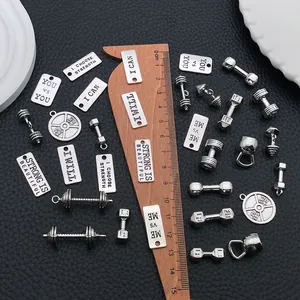 Detailed size reference showing fitness pendants next to a centimeter ruler