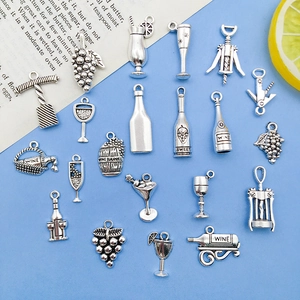 Flat lay of wine-themed silver alloy pendants including bottles and openers for DIY jewelry