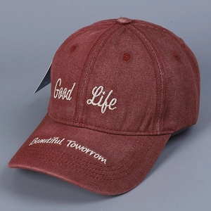 Detail view of washed denim baseball cap with Good Life and Beautiful Tomorrow embroidery
