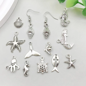 Detailed collection of 13 silver-plated ocean charms including mermaid and starfish