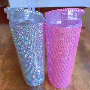 Detail of high-capacity double-layer tumblers with sparkly silver and pink rhinestones