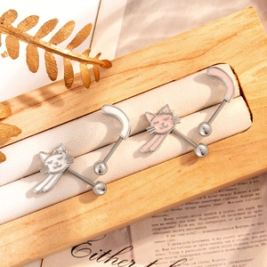 Sweet titanium cat ear studs with white and pink enamel details in a wooden box