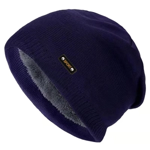 Close-up of thick grey fleece lining and knit texture of a warm winter beanie hat