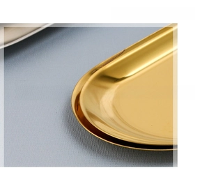 Close-up of golden stainless steel tray showing 1mm thickness and mirror finish edge