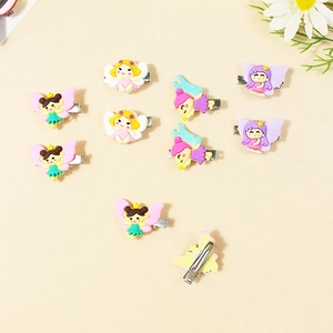 Flat lay of colorful fairy cartoon hair clips with metal duckbill clips on beige background