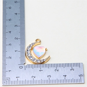 Detailed measurement of gold moon and heart pendant with opal stone and tiny crystals