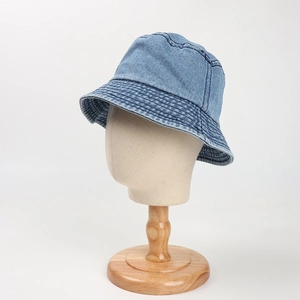 Close-up of light blue denim bucket hat with reinforced stitching on the brim