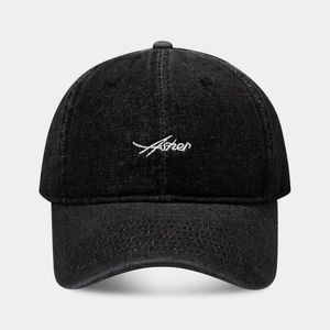 Classic black denim baseball cap with white Asher cursive embroidery on front