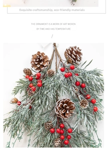 Close-up of Christmas rattan ornament with pine needles, cones and red berries