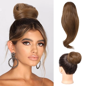 Detailed back view of a brown messy hair bun extension showing natural fluffy texture