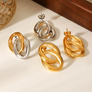 Detail of interlocking oval hoop earrings in gold, silver, and mixed dual-tone finish