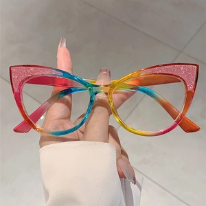 Detail of pink glitter texture on cat eye glasses with rainbow gradient finish