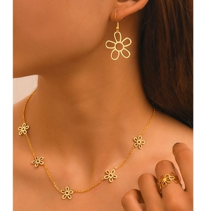Elegant gold-plated hollow flower necklace, earrings, and ring jewelry set for women
