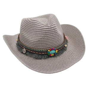 Detail of bohemian western cowboy straw hat featuring colorful beads and turquoise stone