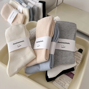Cozy vertical ribbed cotton crew socks in pastel colors for women, minimalist style