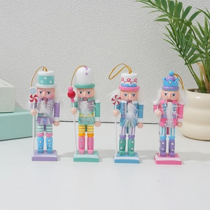Set of four 12cm macaron-colored wooden Christmas nutcracker ornaments with gold hanging strings