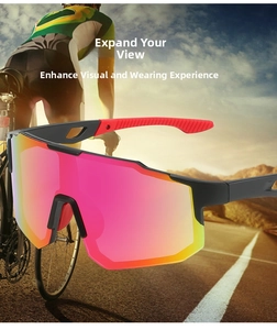 Close-up of polarized cycling sunglasses with red gradient lens on a road bike path