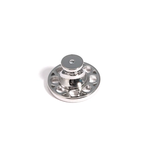 Macro shot of silver metal earring lifters with supportive round base and hollow holes
