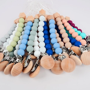Silicone and beech wood pacifier clip set for babies in various pastel colors