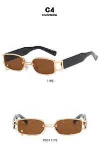 Detail view of gold rectangle sunglasses with side ring decor and brown lenses