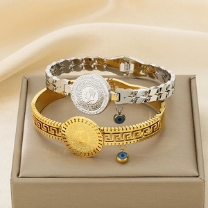 Retro evil eye coin charms on gold and silver stainless steel bangles for women